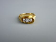 AN EIGHTEEN CARAT GOLD THREE STONE DIAMOND RING, visual estimate 0.1/0.15/0.1 carat, total 5.2 grms