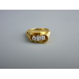 AN EIGHTEEN CARAT GOLD THREE STONE DIAMOND RING, visual estimate 0.1/0.15/0.1 carat, total 5.2 grms