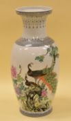 A TWENTIETH CENTURY ORIENTAL VASE the body decorated with peacocks in an exotic garden, character