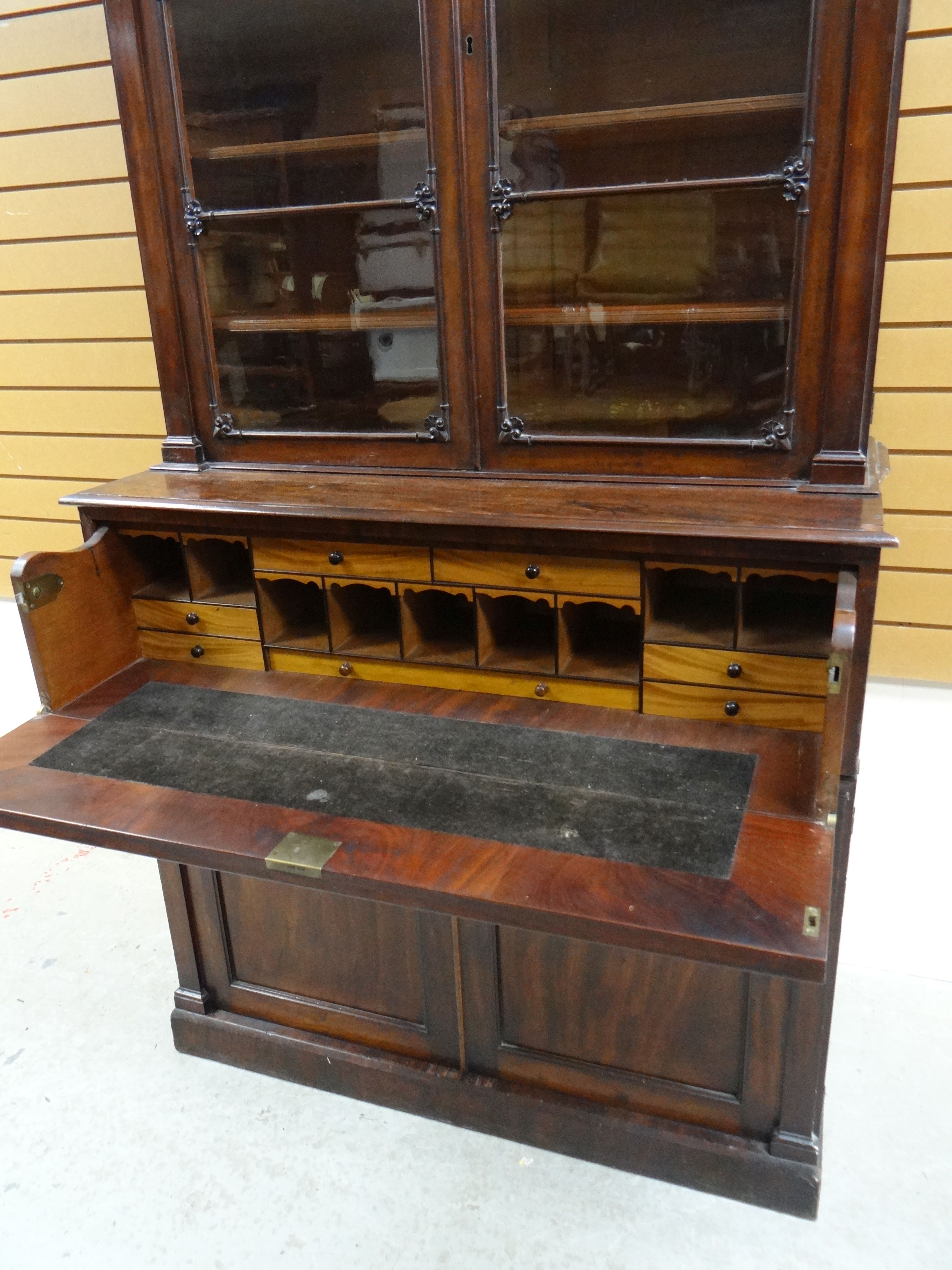 AN EMPIRE MAHOGANY SECRETAIRE BOOKCASE composed of base two-door cupboard and fold down drawer to - Image 2 of 2