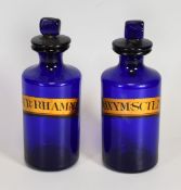 TWO BLUE GLASS PHARMACEUTICAL JARS with labels