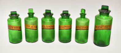 SIX GREEN GLASS ANTIQUE PHARMACEUTICAL JARS WITH LABELS