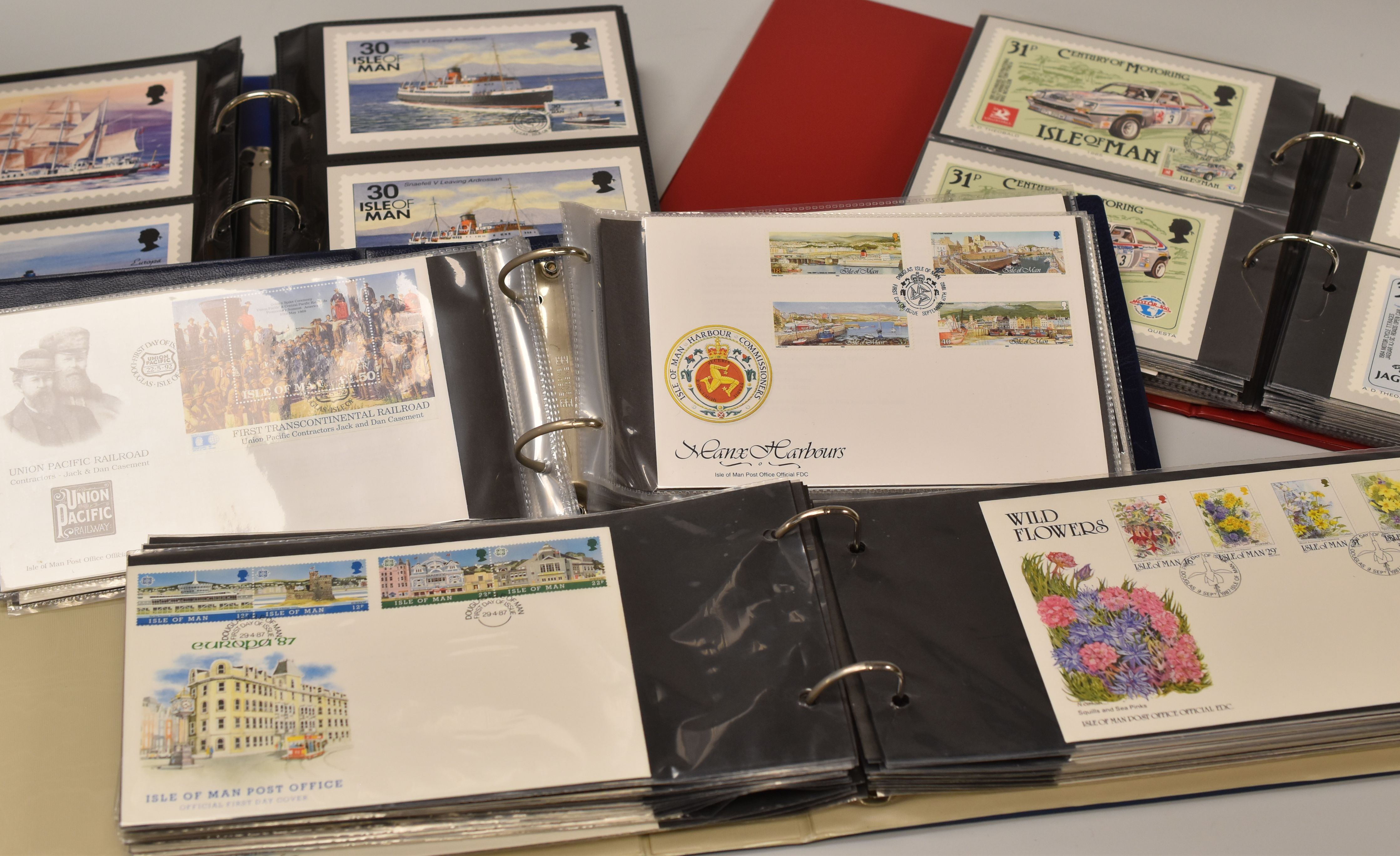 THIRTEEN ALBUMS OF ISLE OF MAN POST OFFICE FIRST DAY COVERS ETC & FIVE ALBUMS OF ISLE OF MAN POST