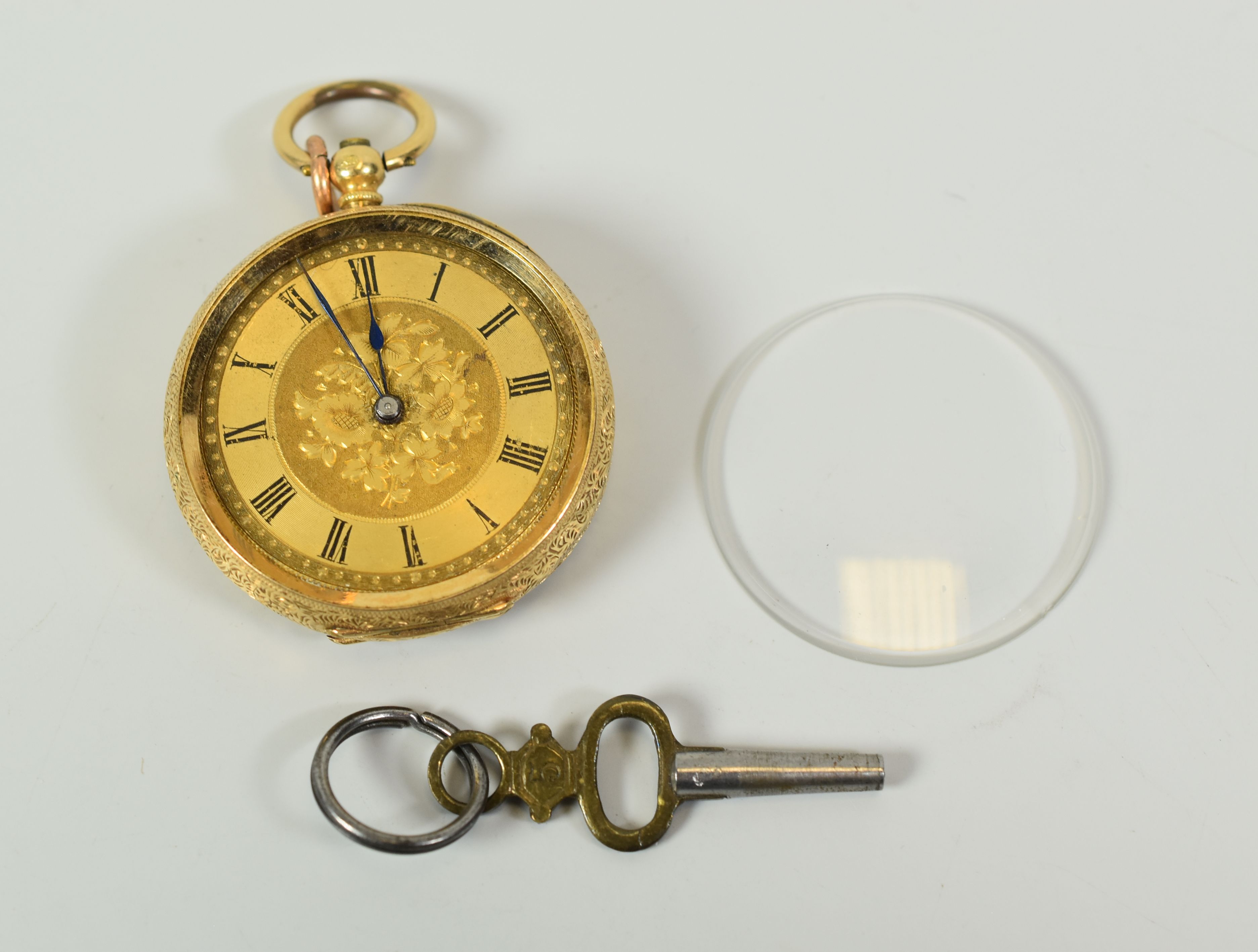 AN 18K GOLD OPEN FACE POCKET WATCH with key for winding and box, fully engraved case and Roman