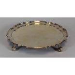 AN ELIZABETH II SILVER SALVER with crimped and stepped gallery-rim with four scroll feet, Birmingham