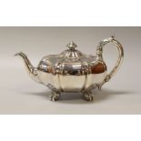 AN EARLY VICTORIAN MELON SHAPED SILVER TEAPOT on four scrolled acanthus supports, acanthus handle