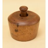 A VICTORIAN CIRCULAR SYCAMORE BUTTER PRINTER to impress a swan decoration and with turned handle,