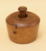 A VICTORIAN CIRCULAR SYCAMORE BUTTER PRINTER to impress a swan decoration and with turned handle,