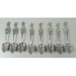 A SET OF EIGHT STERLING SILVER 'COLOMBUS' SPOONS with heart shaped bowls, and the handle featuring