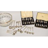 A PARCEL OF SILVER SPOONS including two cased sets of six and sundry mixed loose spoons, 14ozs gross