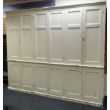 A VERY LARGE PAINTED PINE TWO STAGE HOUSEKEEPING CUPBOARD composed of a base and top each of three