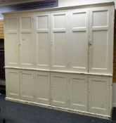 A VERY LARGE PAINTED PINE TWO STAGE HOUSEKEEPING CUPBOARD composed of a base and top each of three