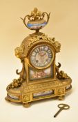 A JAPY FRERES MANTEL CLOCK IN GILDED BRONZE & PORCELAIN of Rococo form with painted porcelain panels