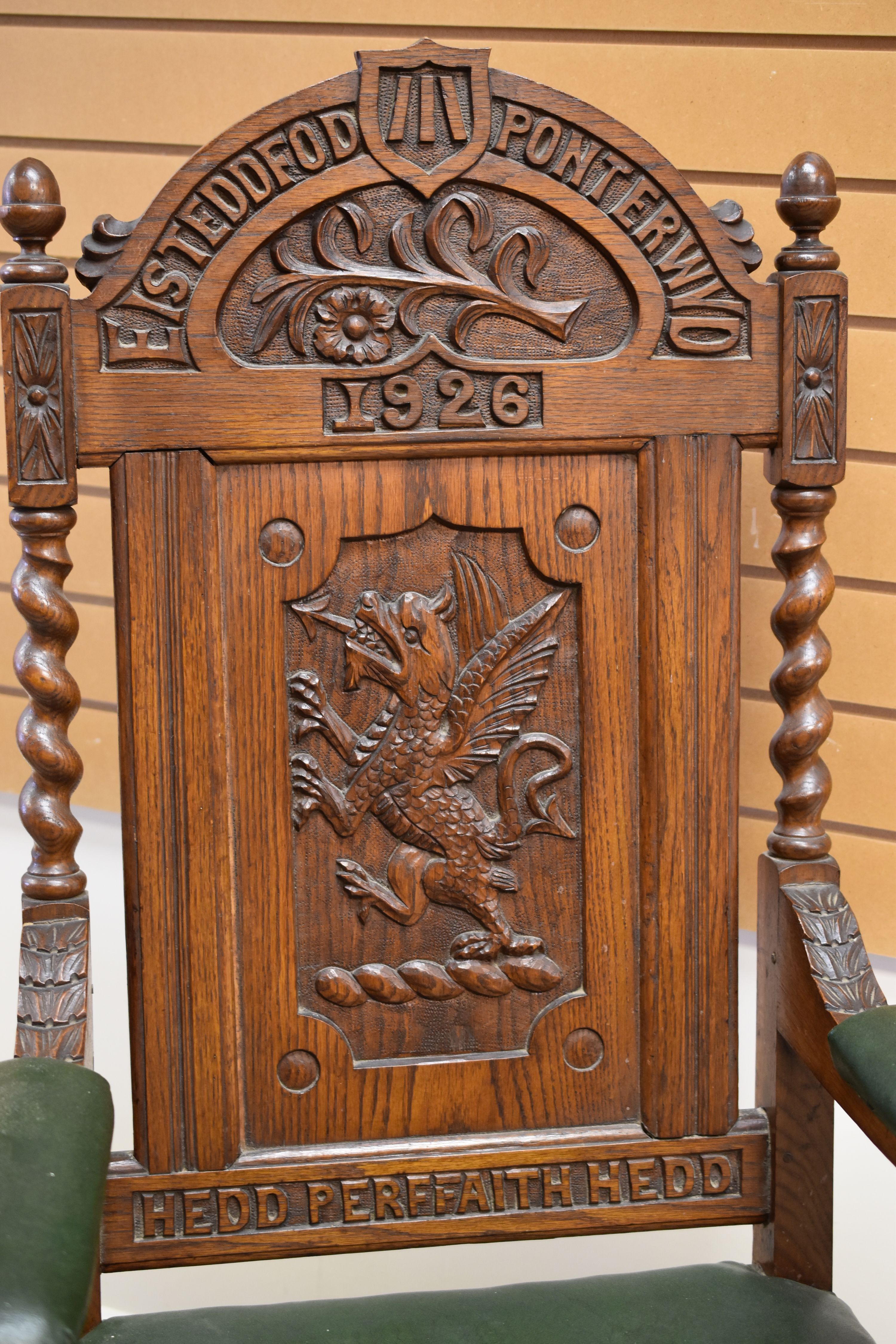 A WELSH EISTEDDFOD CHAIR carved with a dragon to the back and with leek and daffodil above, - Image 2 of 2
