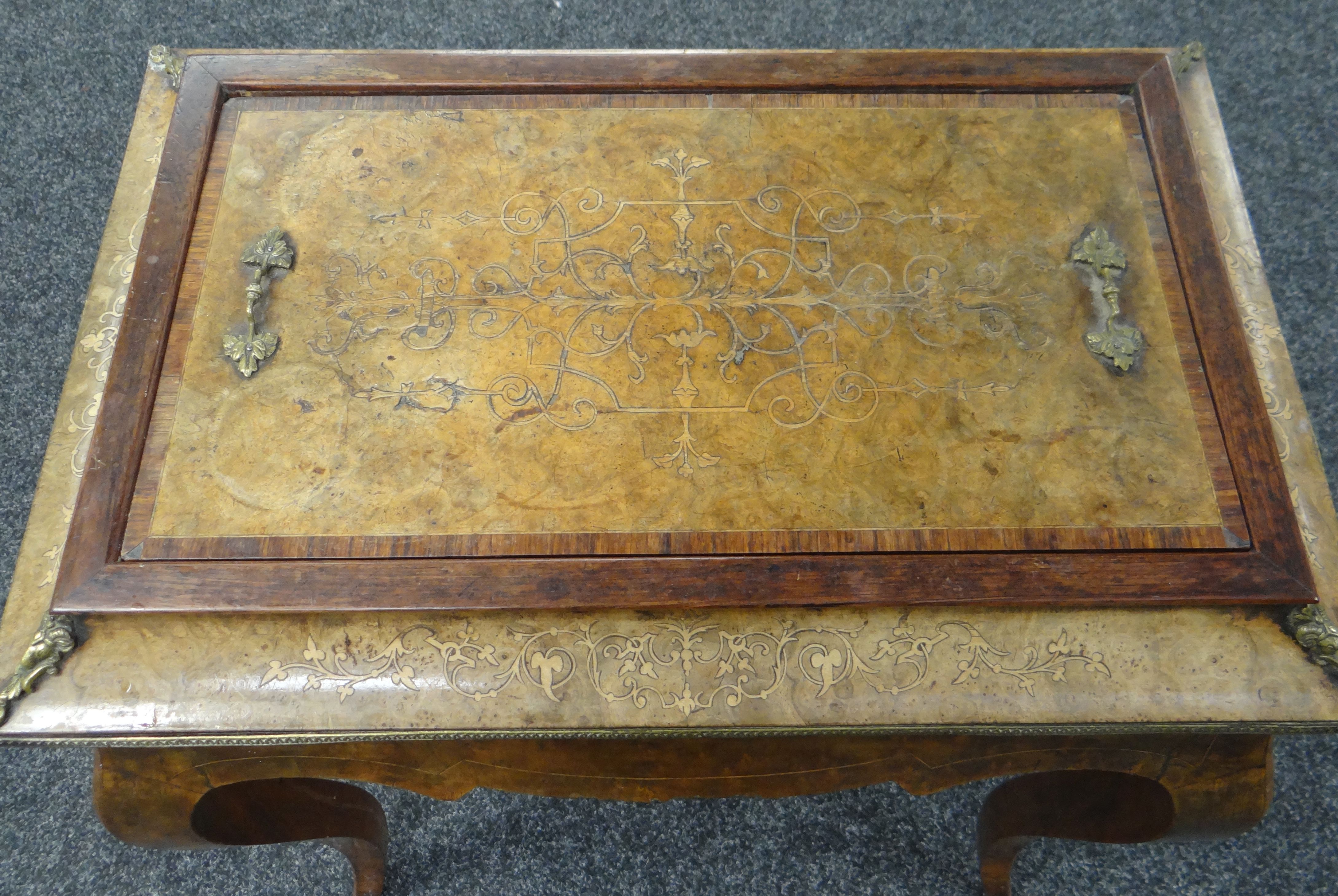 A NINETEENTH CENTURY MARQUETRY WALNUT SEWING TABLE with ormolu fittings and on shaped legs ( - Image 2 of 3