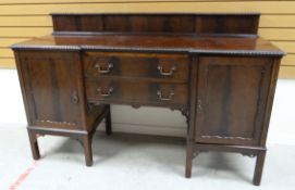 NINETEENTH CENTURY MAHOGANY BREAKFRONT SIDEBOARD having a pair of flanking single cupboard doors and