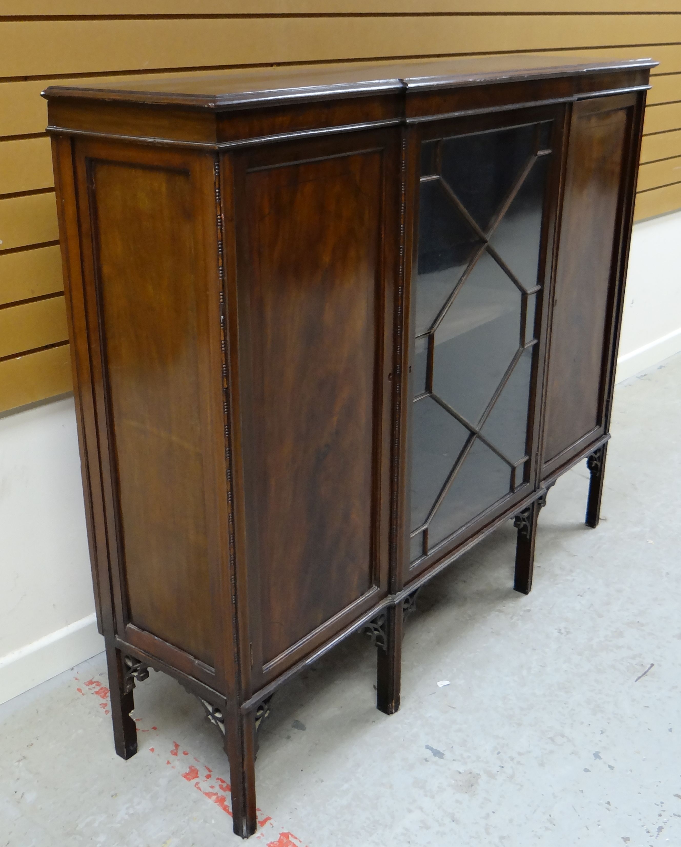 AN EDWARDIAN MAHOGANY BOOKCASE composed of flanking concealed cabinets and astragal glazed centre - Image 2 of 2