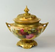 A ROYAL WORCESTER POT-POURRI & COVER raised over an elaborate footed base, having twin handles and