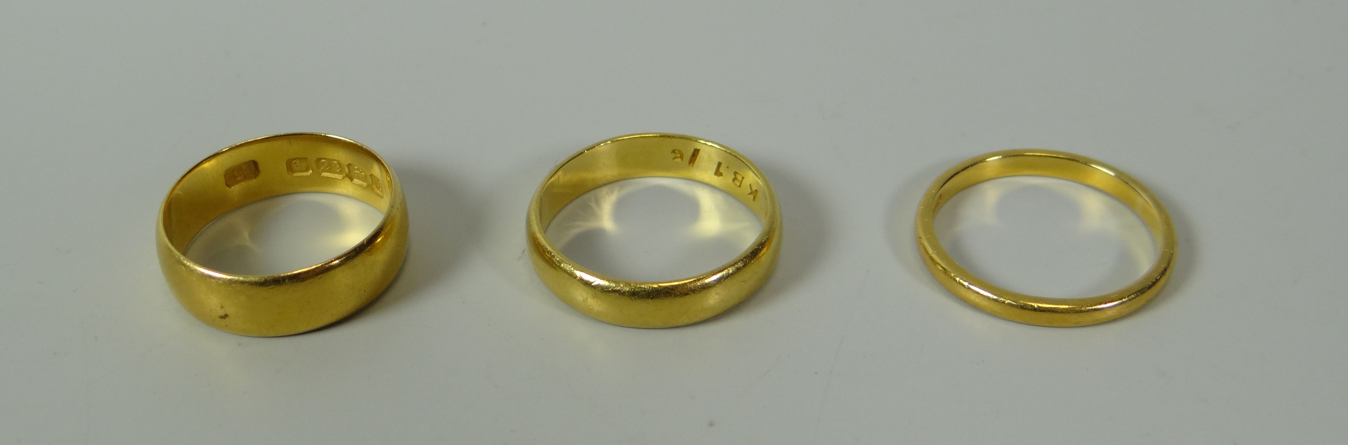 THREE 22CT YELLOW GOLD WEDDING BANDS, 12gms