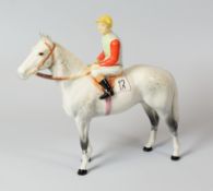 A BESWICK RACEHORSE & MOUNTED JOCKEY the horse in dappled grey, the rider in blue and green silks