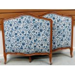 A PAIR OF FRENCH LIGHTWOOD SINGLE BED ENDS with blue & white floral upholstery