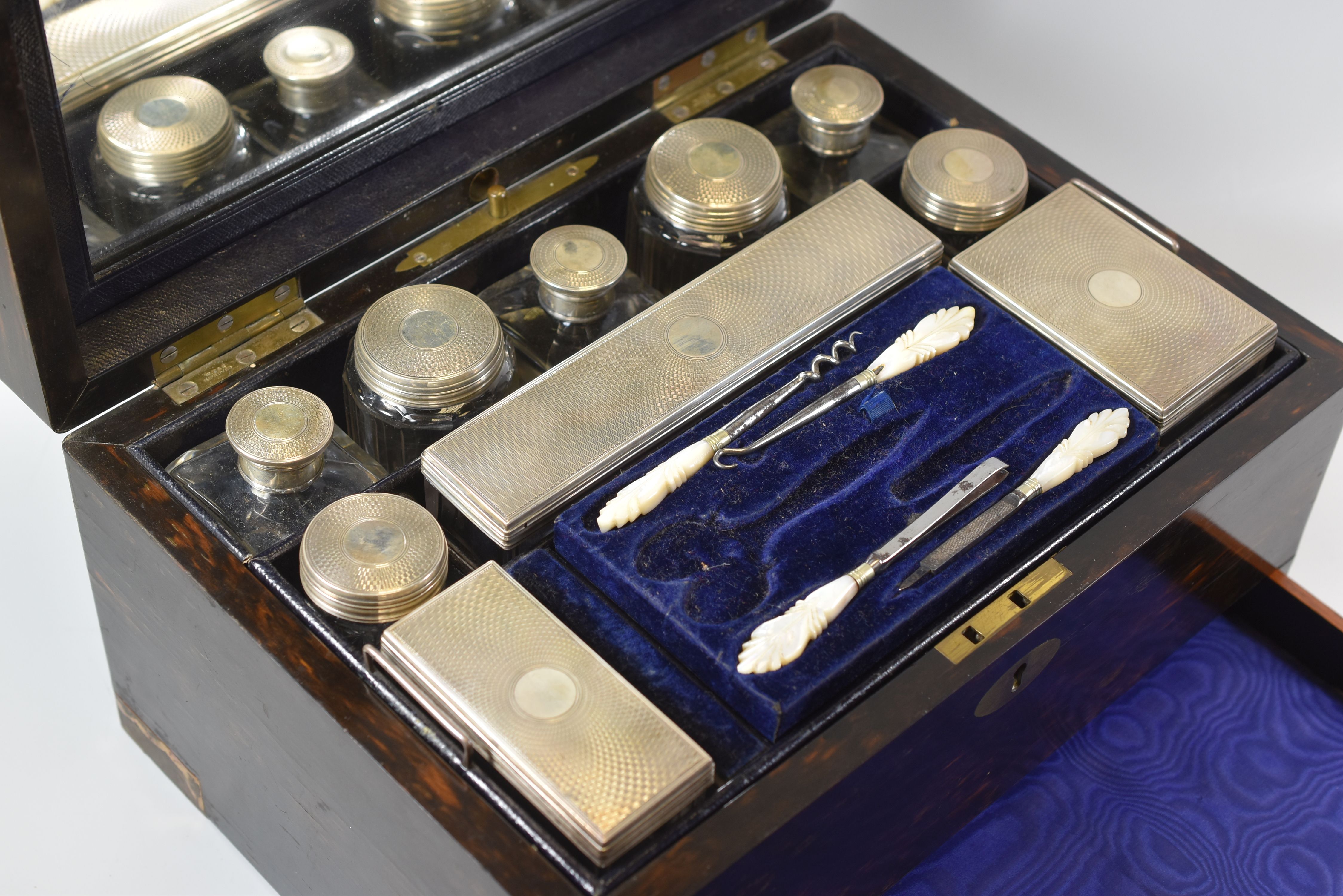 A COROMANDEL VANITY BOX WITH FITTED SILVER CONTENTS bearing maker's label for Stocken & Co, the - Image 2 of 5