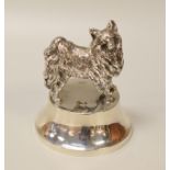 A SILVER COLLIE DOG PAPERWEIGHT the base of circular form and weighted, hallmarks for London 1910,