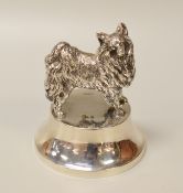 A SILVER COLLIE DOG PAPERWEIGHT the base of circular form and weighted, hallmarks for London 1910,