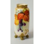 A ROYAL WORCESTER PORCELAIN TUBULAR VASE on four scroll feet and with narrow latticework neck,