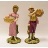 A PAIR OF ROYAL WORCESTER FIGURINE SPILL-HOLDERS of a male and female in pastel glazes and both