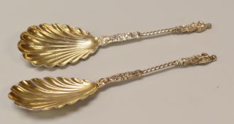 A PAIR OF SHELL BOWL SPOONS in the medieval style with twist stems and apostle terminals, London