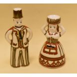 A PAIR OF GERMAN POTTERY FIGURAL MONEY-BOXES, circa 1960s and being a male and female in white