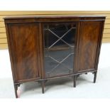 AN EDWARDIAN MAHOGANY BOOKCASE composed of flanking concealed cabinets and astragal glazed centre
