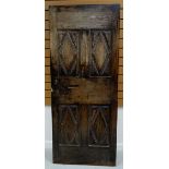 A BELIEVED SEVENTEENTH CENTURY FRENCH PANELLED WOODEN DOOR 74cms wide, 180cms high