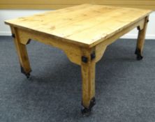 AN UNUSUAL LATE TWENTIETH CENTURY PINE DINING TABLE from reclaimed pine and with iron fittings and