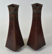 A PAIR OF CHINESE BRONZE VASES on square bases with tapering bodies and with applied dragon