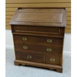 A CONTINENTAL OAK CAMPAIGN-STYLE BUREAU the base with a bank of four drawers and a hinged