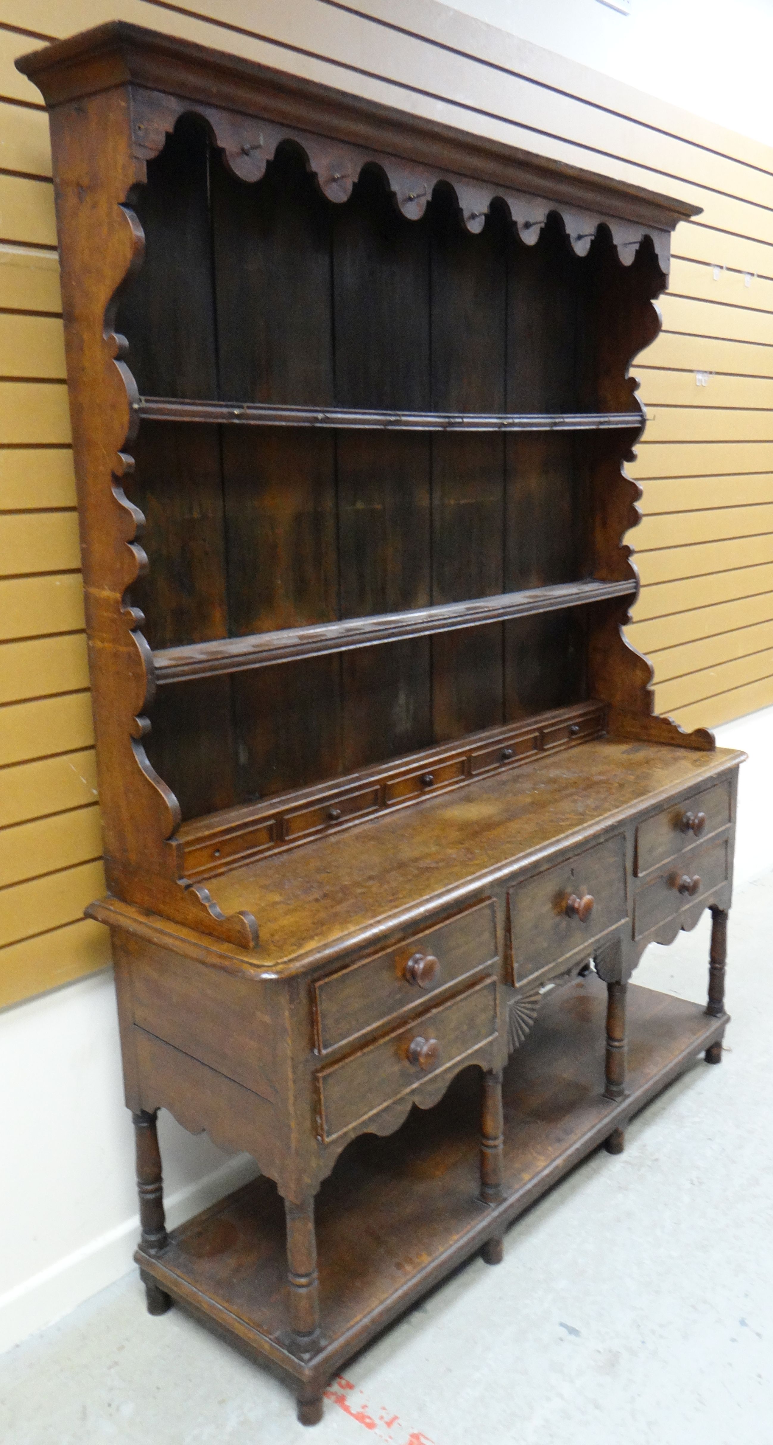 AN OAK WELSH DRESSER BASE with a good borded rack with two shelves, shaped sides and with old hooks, - Image 2 of 6