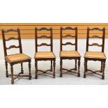 A SET OF FOUR FRENCH CANE WORK CHAIRS having carved ladder backs, carved supports, X-stretcher and
