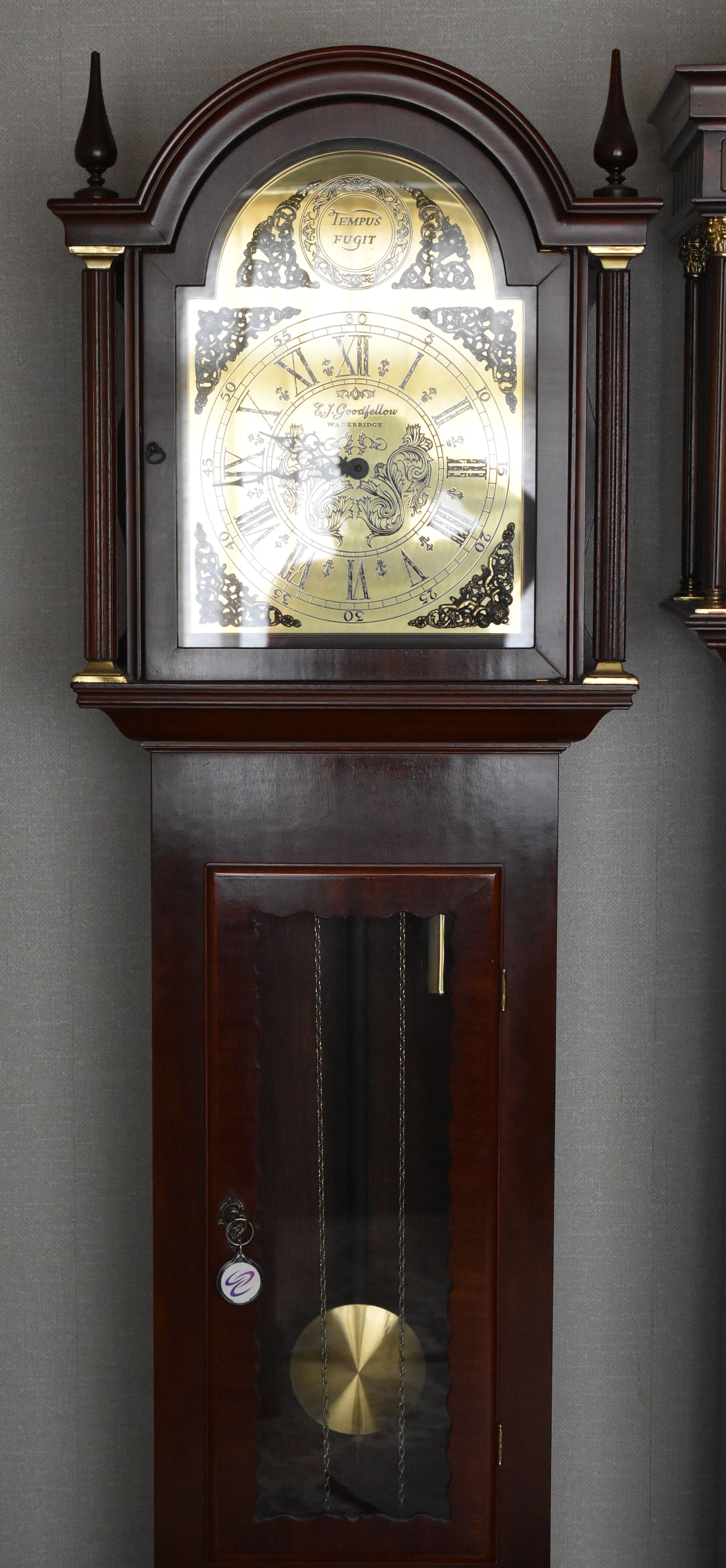 A REPRODUCTION E J GOODFELLOW LONGCASE / GRANDMOTHER CLOCK with elaborate brass dial, 188cms high