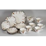A SHELLEY 20 PIECE TEA-SET floral decorated with chocolate rim, comprising serving plate, six tea-