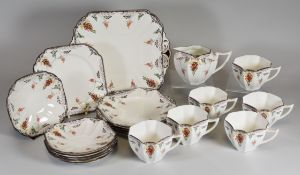 A SHELLEY 20 PIECE TEA-SET floral decorated with chocolate rim, comprising serving plate, six tea-