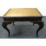 AN UNUSUAL CHINESE CARVED TABLE with inset brass top, the brass engraved with a floral border and