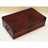 A CHINESE TRUNK IN PIG-SKIN LEATHER with two handles and printed interior, 76cms wide