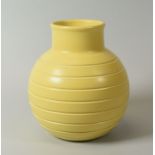 A KEITH MURRAY FOR WEDGWOOD GLOBULAR VASE with incised linear decoration in pastel yellow glaze,