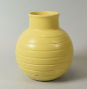 A KEITH MURRAY FOR WEDGWOOD GLOBULAR VASE with incised linear decoration in pastel yellow glaze,