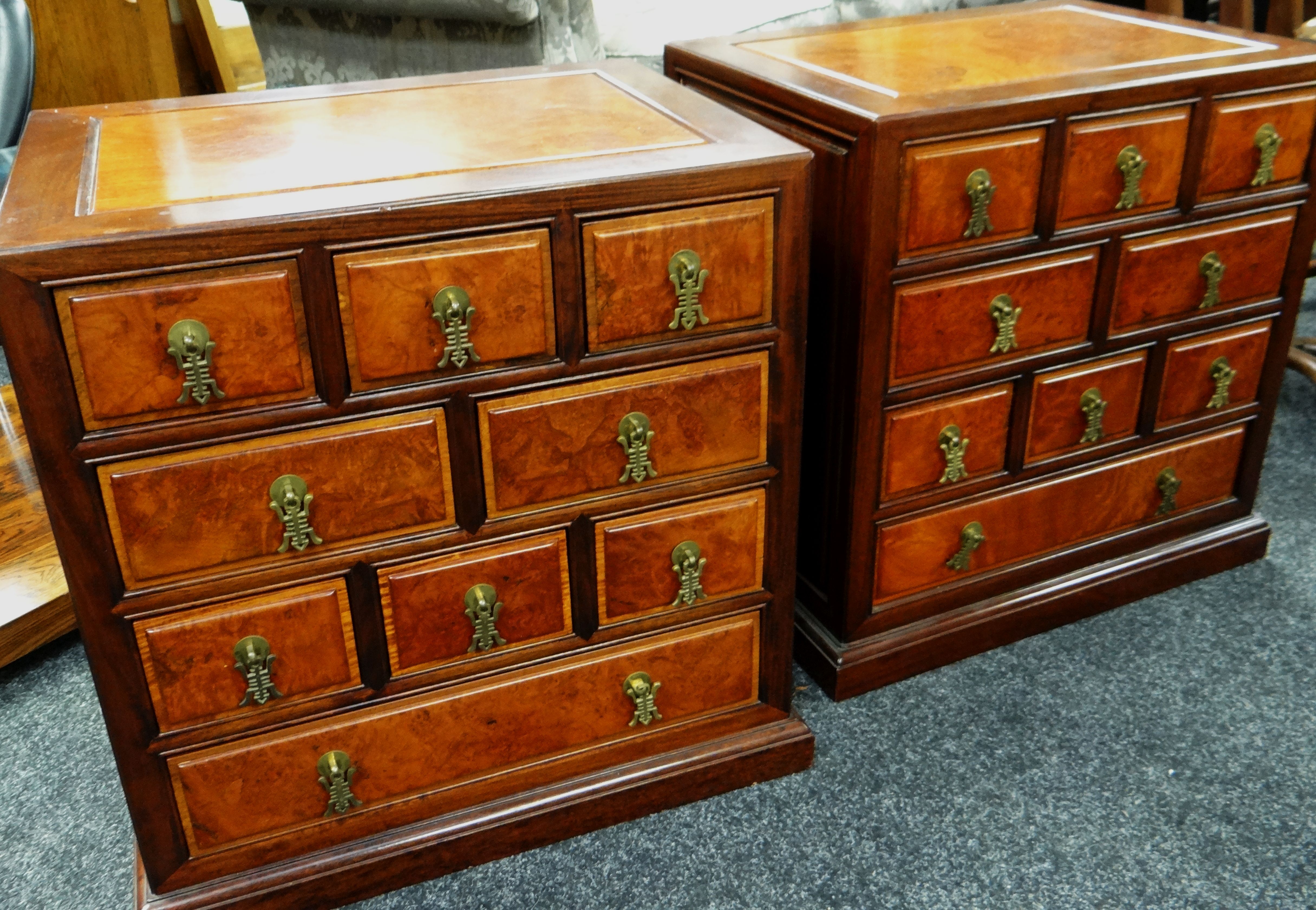 A PAIR OF SMALL MODERN CHESTS WITH AN ARRANGEMENT OF NINE DRAWERS, 56cms wide