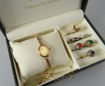 A 9CT GOLD LADIES 'SOVEREIGN' BRACELET WATCH & SIX LADIES RINGS, the watch with matching box and