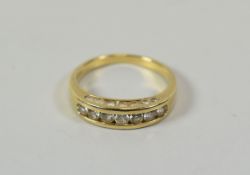 A 9CT GOLD SEVEN STONE DIAMOND RING, 2.8gms