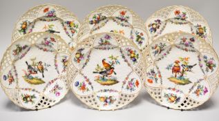 A SET OF SIX KPM PORCELAIN PLATES with pierced and lattice borders and painted with pairs of